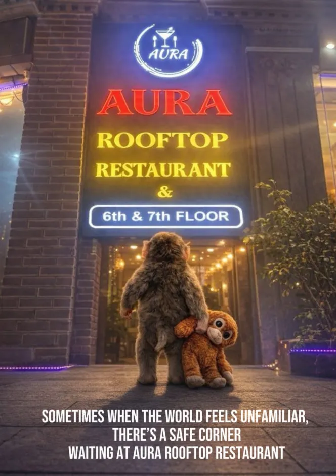The Aura Rooftop Restaurant neon sign marking the 6th and 7th floor entrance