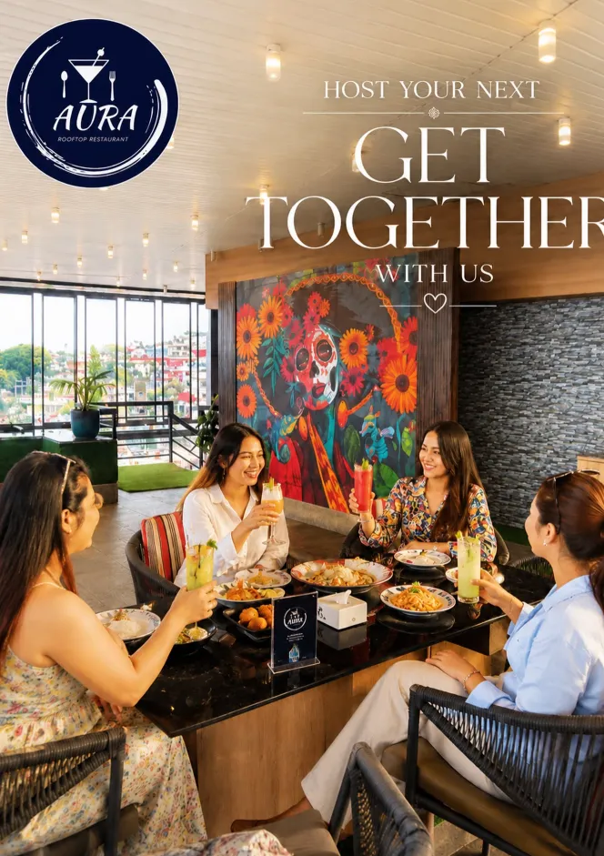 Friends enjoying a get-together meal together at Aura Rooftop