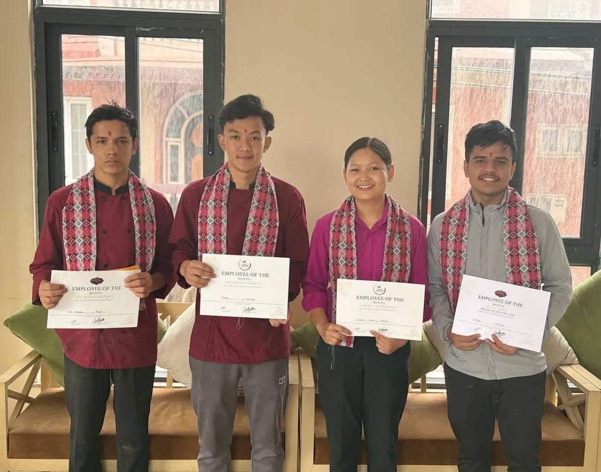 Aura team members holding certificates of appreciation